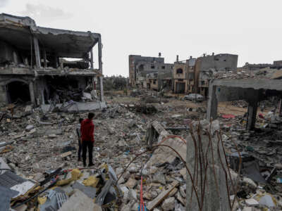 Palestinian citizens inspect the effects of destruction caused by air strikes on their homes in the Khuza’a area on November 27, 2023, in Khan Yunis, Gaza.