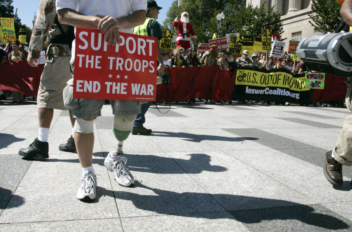 A U.S. Army veteran who was injured in Afghanistan in 2004 takes part in a protest march from the White House to the U.S. Capitol to demand an end to the war in Iraq, the return of U.S. troops and the impeachment of U.S. President George W. Bush in Washington, D.C., on September 15, 2007.