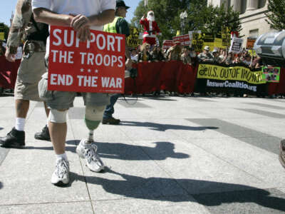 A U.S. Army veteran who was injured in Afghanistan in 2004 takes part in a protest march from the White House to the U.S. Capitol to demand an end to the war in Iraq, the return of U.S. troops and the impeachment of U.S. President George W. Bush in Washington, D.C., on September 15, 2007.