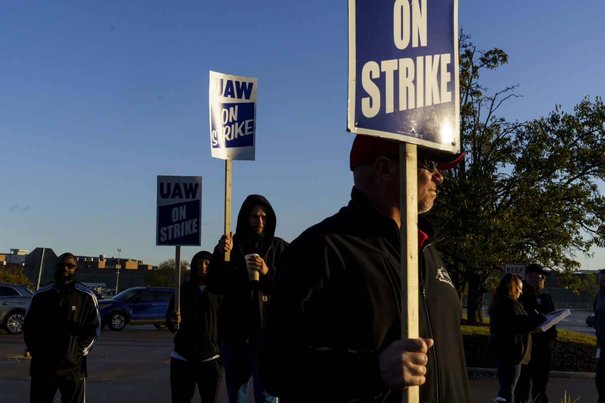 Factory workers and UAW union members form a picket line outside the Ford Motor Co. Kentucky Truck Plant in the early morning hours on October 14, 2023, in Louisville, Kentucky.