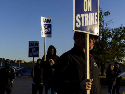 Factory workers and UAW union members form a picket line outside the Ford Motor Co. Kentucky Truck Plant in the early morning hours on October 14, 2023, in Louisville, Kentucky.