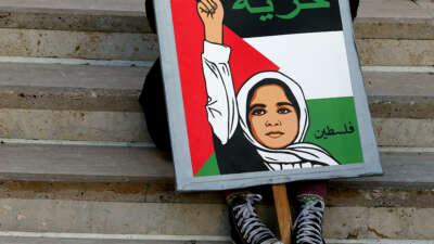 A supporter waits for a a rally to begin after a student walkout in solidarity with Palestine on October 25, 2023, in Santa Ana, California.