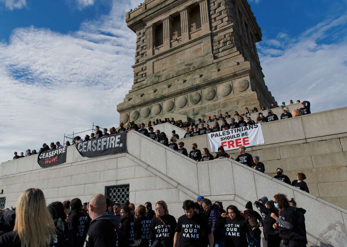 Jewish Voice for Peace protesters call for a ceasefire in Gaza outside the Statue of Liberty.