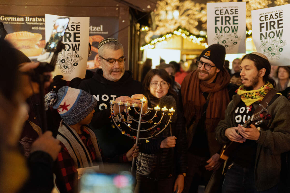 Jewish organizers and their allies participate in a demonstration at the Washinton Street Bridge in Chicago, Illinois, blocking traffic as part of protest to draw attention to Israel's attacks on Gaza, on December 14, 2023.