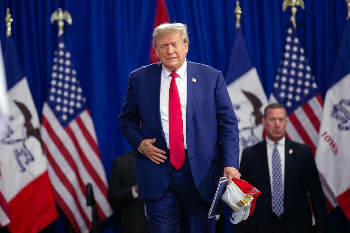 Donald Trump walks toward a stage