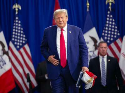 Donald Trump walks toward a stage