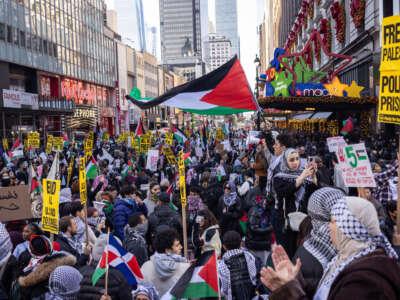 People gather during a demonstration in support of Palestinians outside Macy's in New York City on November 24, 2023.