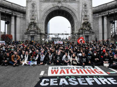 Activists from the group Jewish Voice for Peace stage a sit-in blockade of the Manhattan Bridge on November 26, 2023, in New York City.