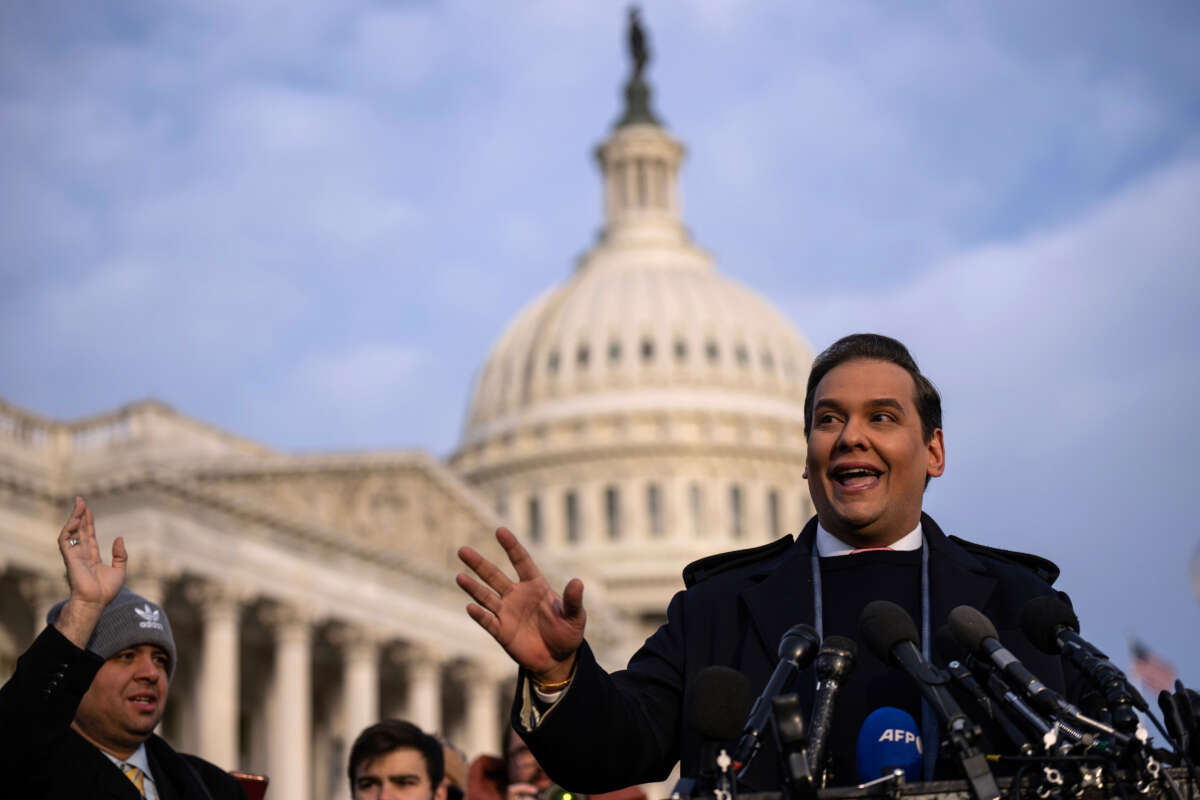 Rep. George Santos talks to reporters outside the U.S. Capitol on November 30, 2023, in Washington, D.C.