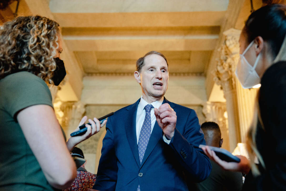 Senate Ron Wyden speaks with reporters after the passage of the Inflation Reduction Act on Capitol Hill in Washington, D.C., on August 7, 2022.