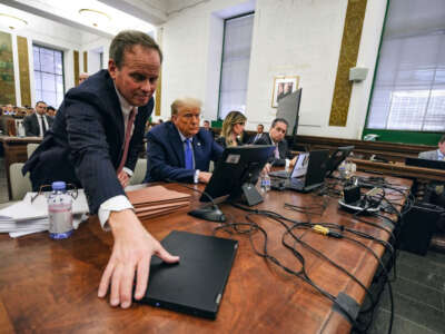 Former President Donald Trump sits in the courtroom with attorneys Christopher Kise (left) and Alina Habba during his civil fraud trial at New York State Supreme Court on November 6, 2023, in New York City.