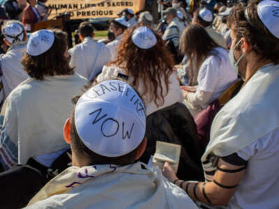 People wear yarmulke with Ceasefire Now written on it during a Jewish Shacharit morning prayer service near the U.S. Capitol on Capitol Hill on November 13, 2023. Rabbis for Ceasefire held a prayer service to pray for a ceasefire in Gaza.