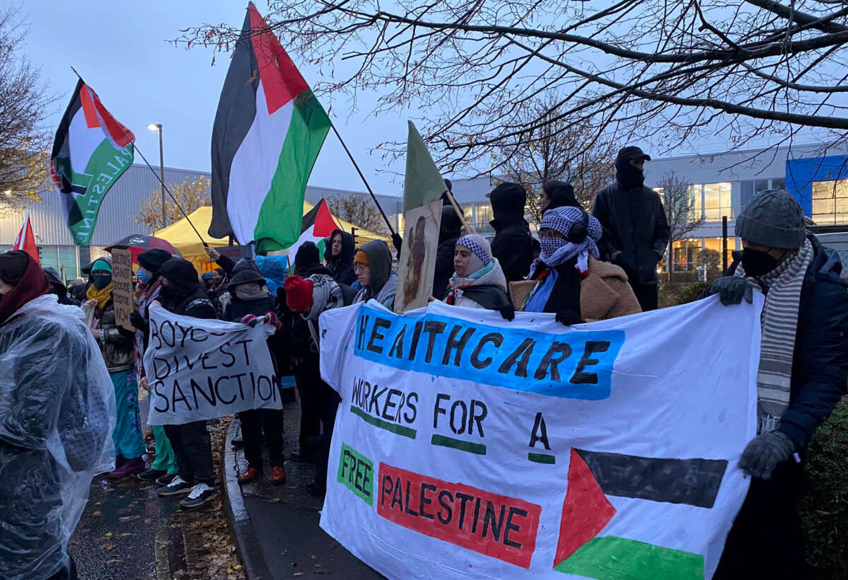 Trade unionists protest a factory in Wimborne Minster, England, that makes components for planes used in Israel's bombardment of Gaza on December 7, 2023.