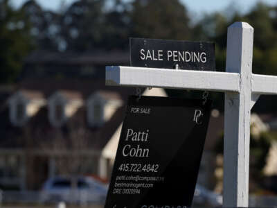 A "sale pending" sign is posted in front of a home for sale on November 30, 2023, in Larkspur, California.