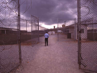 Convicts at the Limestone Correctional facility are placed on a chain gang when they leave the prison grounds for their daily labor as road crews in July of 1995 outside of Huntsville, Alabama.