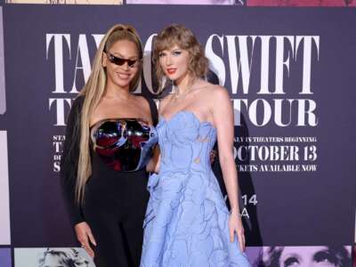 Beyoncé Knowles-Carter and Taylor Swift pose for a photograph outside of Taylor Swift's "Taylor Swift: The Eras Tour" movie