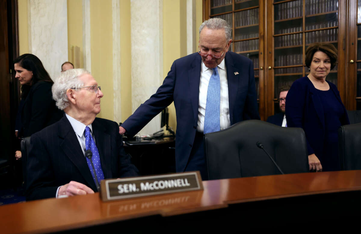 From left, Senate Minority Leader Mitch McConnell, Senate Majority Leader Charles Schumer and Senate Rules Committee Chair Amy Klobuchar arrive for a Rules Committee hearing at the Russell Senate Office Building on November 14, 2023, in Washington, D.C.