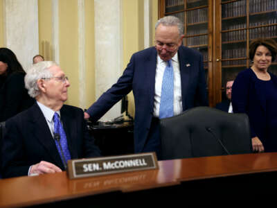 From left, Senate Minority Leader Mitch McConnell, Senate Majority Leader Charles Schumer and Senate Rules Committee Chair Amy Klobuchar arrive for a Rules Committee hearing at the Russell Senate Office Building on November 14, 2023, in Washington, D.C.