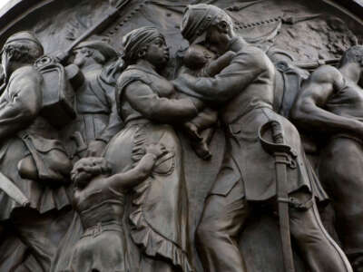 The northeast side of the Confederate memorial at Arlington National Cemetery, depicting a slave woman holding a baby being kissed by a Confederate officer, is photographed on August 17, 2017, in Arlington, Virginia.