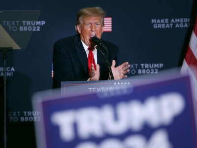 Former President Donald Trump speaks during a campaign event at the Hyatt Hotel on December 13, 2023, in Coralville, Iowa.