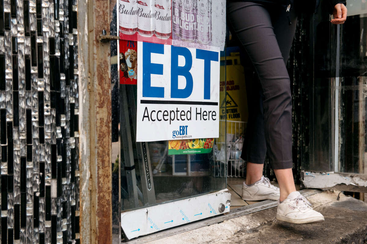 A sign alerting customers about SNAP food stamps benefits is displayed at a Brooklyn grocery store on December 5, 2019, in New York City.