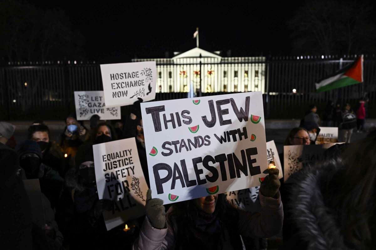 Jewish groups gather outside the White House on the fifth night of Hanukkah, the Jewish festival of lights, to protest Israel's attacks on Gaza, in Washington, D.C. on December 11, 2023.