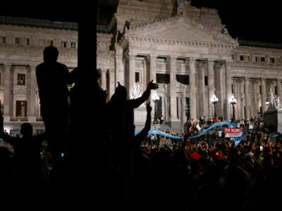 People bang pans and pots during a demonstration against the new government of Argentine President Javier Milei in front of the National Congress in Buenos Aires, on December 20, 2023.