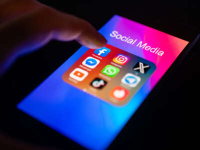 A close-up of a finger is pointing to the Facebook mobile app on a smartphone screen, which is displayed alongside other apps including Instagram, WhatsApp, Telegram, TikTok, Tinder, YouTube, and Messenger, on November 30, 2023.