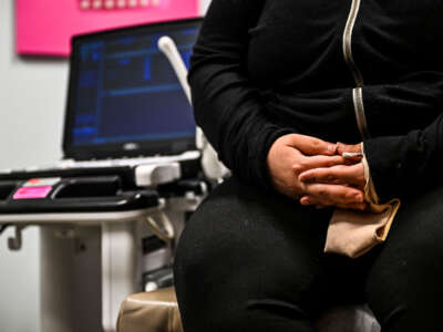 A woman sits in an examination room as she waits to receive an abortion at the Planned Parenthood Abortion Clinic in West Palm Beach, Florida, on July 14, 2022.