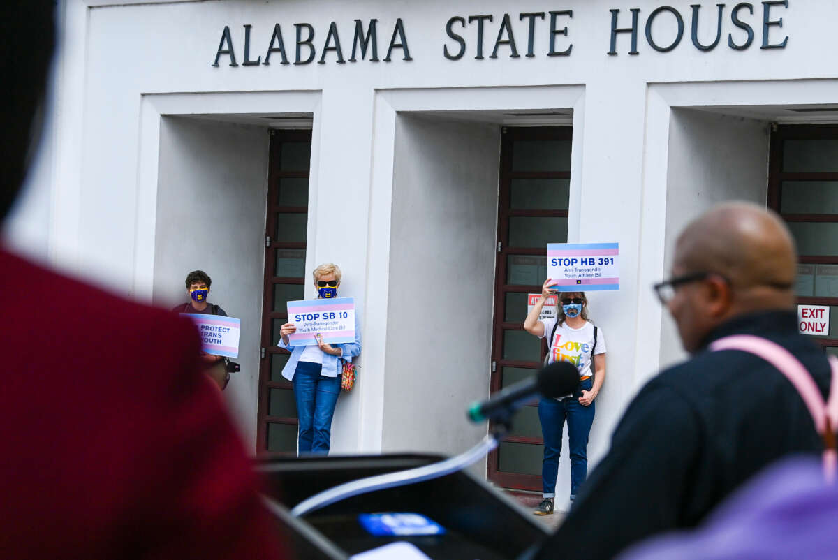 Opponents of several bills targeting transgender youth attend a rally at the Alabama State House to draw attention to anti-transgender legislation introduced in Alabama on March 30, 2021, in Montgomery, Alabama.