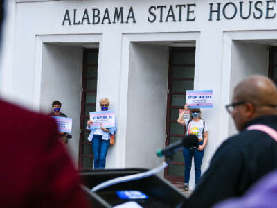 Opponents of several bills targeting transgender youth attend a rally at the Alabama State House to draw attention to anti-transgender legislation introduced in Alabama on March 30, 2021, in Montgomery, Alabama.