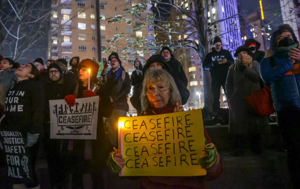 A community of Jewish groups gather at the Columbus Circle during the first night of Hanukkah to protest Israel's attacks on Gaza in Manhattan, New York, on December 7, 2023.
