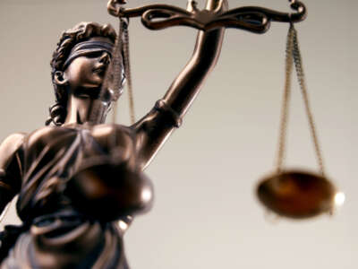 Lady justice holding scales statue
