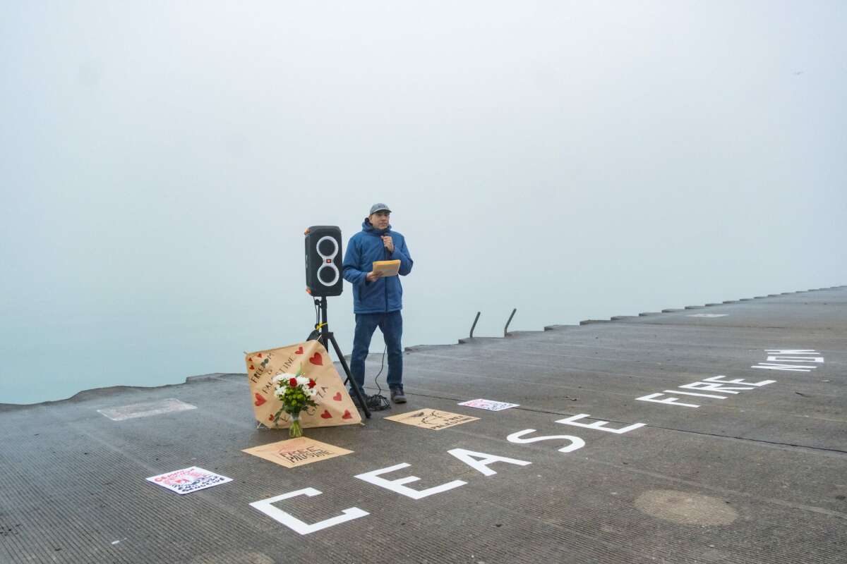 People gather at the lakefront to mourn Palestinian writer and activist Refaat Alareer, on December 23, 2023, in Chicago, Illinois.