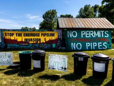 Waste segregation bins are seen in the campsite on the White Earth Nation Reservation near Waubun, Minnesota, on June 5, 2021.