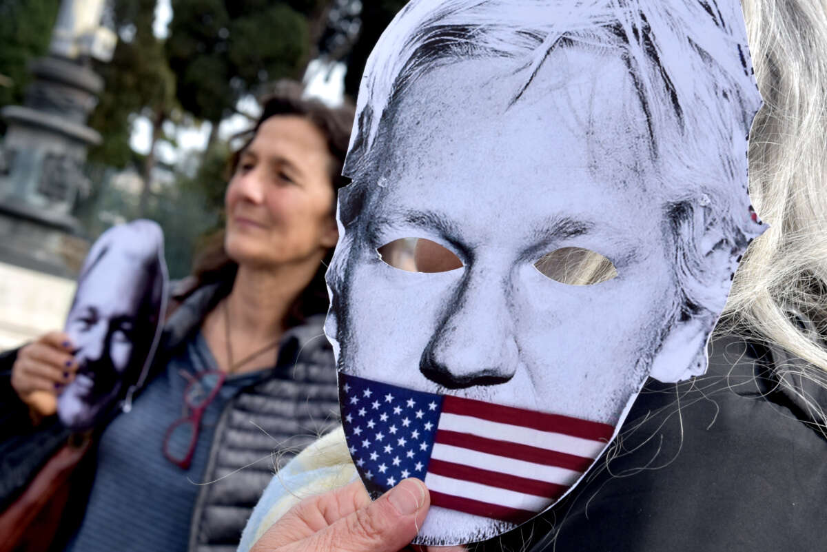 People protest in Piazza della Repubblica to demand the freedom of Julian Assange, with banners, placards and silhouettes depicting the journalists in prison, on April 11, 2023, in Rome, Italy.