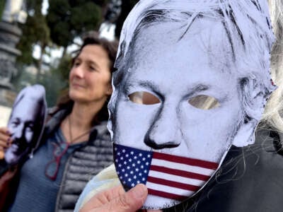 People protest in Piazza della Repubblica to demand the freedom of Julian Assange, with banners, placards and silhouettes depicting the journalists in prison, on April 11, 2023, in Rome, Italy.