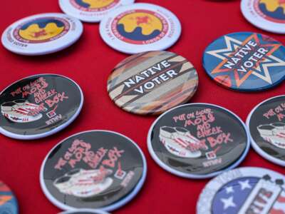 Pins reading "Native Voter" are pictured at a display counter during a cultural meeting at the Comanche Nation fairgrounds in Lawton, Oklahoma, on September 30, 2023.