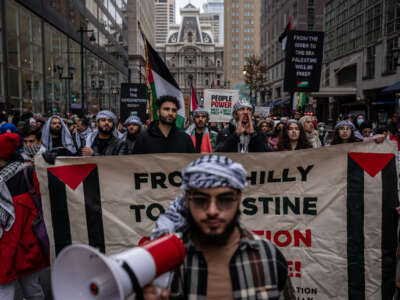 Demonstrators holding Palestinian flags and banners, gather to stage a demonstration in Philadelphia, Pennsylvania, on December 23, 2023.