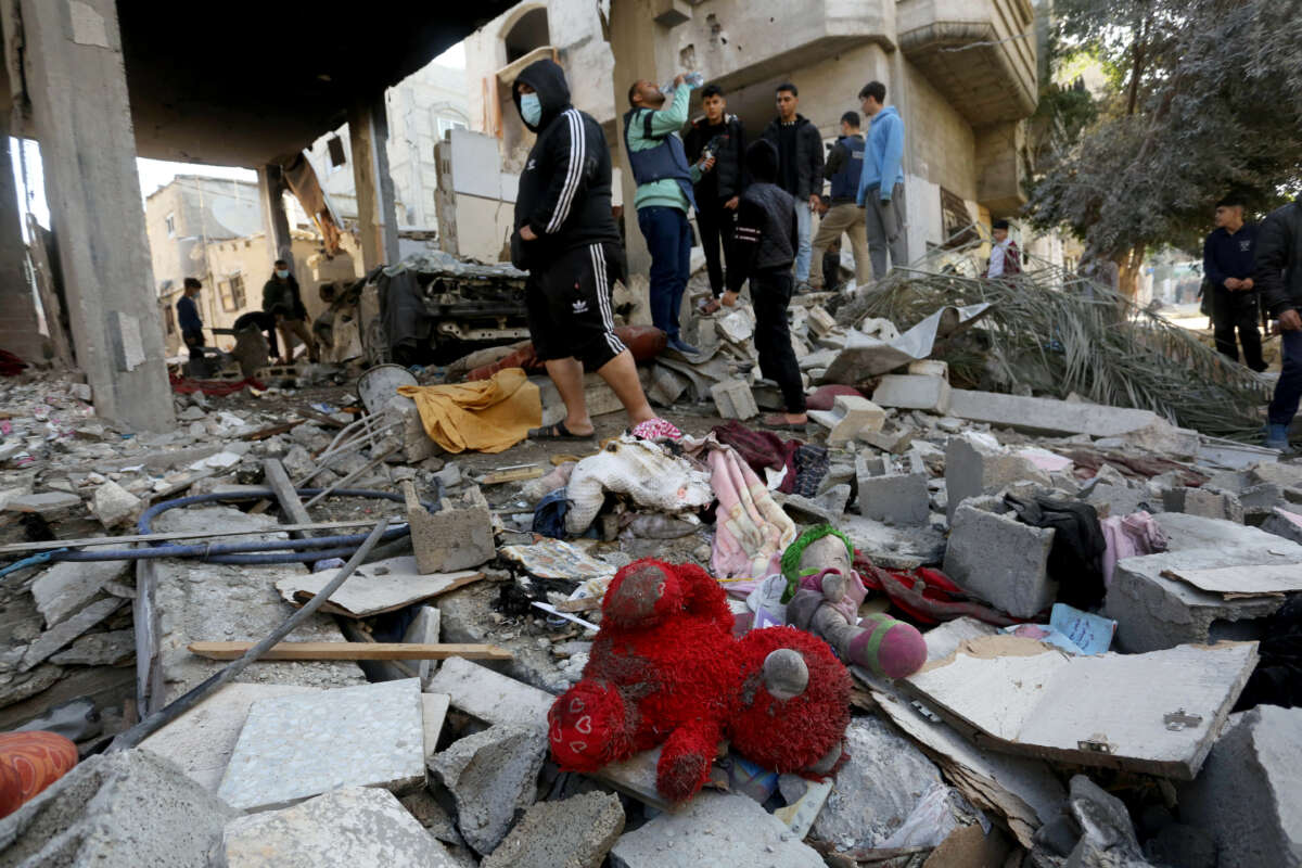 A teddy bear is seen among the rubble of an almost completely collapsed building after an Israeli attack on Nuseirat refugee camp in Deir al-Balah, Gaza, on December 30, 2023.