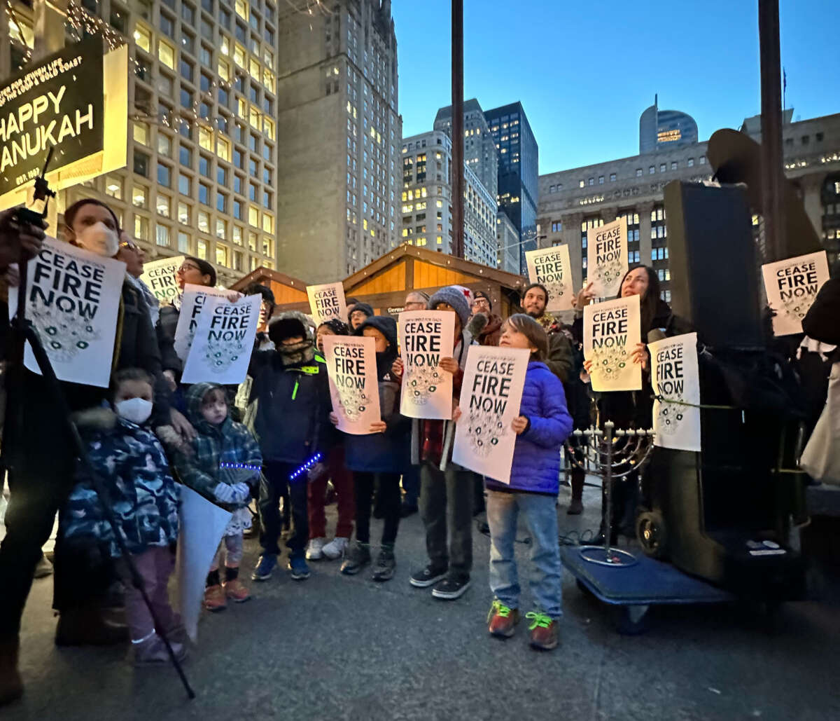 Jewish organizers and their allies participate in a demonstration at the Washinton Street Bridge in Chicago, Illinois, blocking traffic as part of protest to draw attention to Israel's attacks on Gaza, on December 14, 2023.