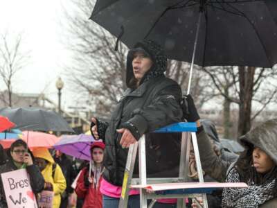 Monica Cosby of Moms United Against Violence and Incarceration speaks at an action on January 16, 2017.