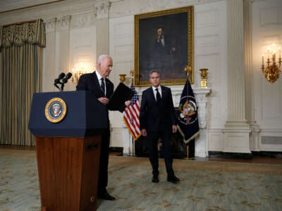 President Joe Biden, joined by Secretary of State Antony Blinken, leaves after delivering remarks on the Hamas attacks in Israel in the State Dining Room of the White House on October 10, 2023, in Washington, D.C.