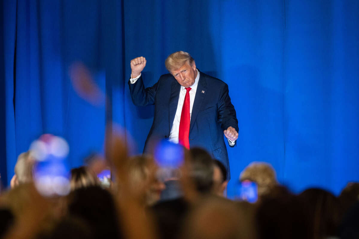 Former President Donald Trump dances at the edge of the stage following his speech at the New Hampshire Federation of Republican Women's Lilac Luncheon on June 27, 2023, in Concord, New Hampshire.