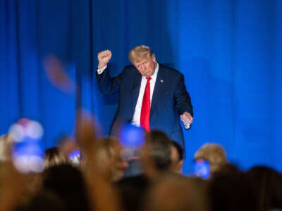 Former President Donald Trump dances at the edge of the stage following his speech at the New Hampshire Federation of Republican Women's Lilac Luncheon on June 27, 2023, in Concord, New Hampshire.