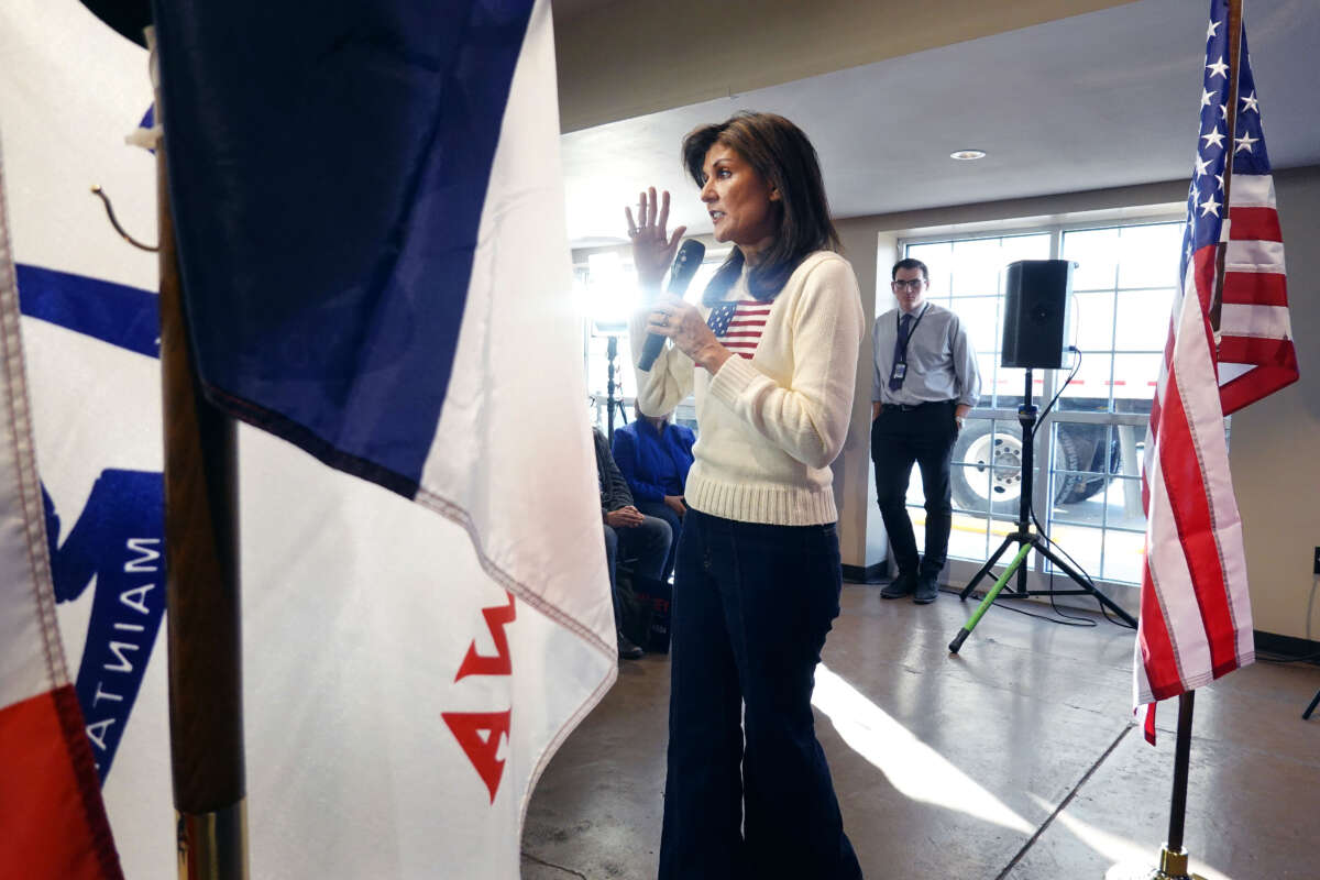 Republican presidential candidate Nikki Haley addresses guests during a campaign stop at the Nevada Fairgrounds community building on December 18, 2023, in Nevada, Iowa.