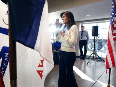 Republican presidential candidate Nikki Haley addresses guests during a campaign stop at the Nevada Fairgrounds community building on December 18, 2023, in Nevada, Iowa.