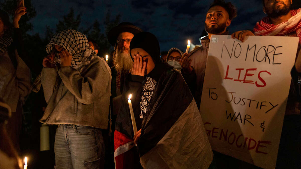 Demonstrators participate in a candlelight vigil organized by New York University students in support of Palestinians, at Washington Square Park in New York City, on October 17, 2023.