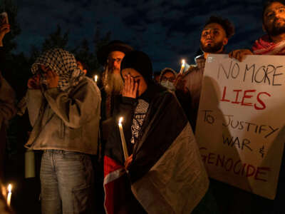 Demonstrators participate in a candlelight vigil organized by New York University students in support of Palestinians, at Washington Square Park in New York City, on October 17, 2023.