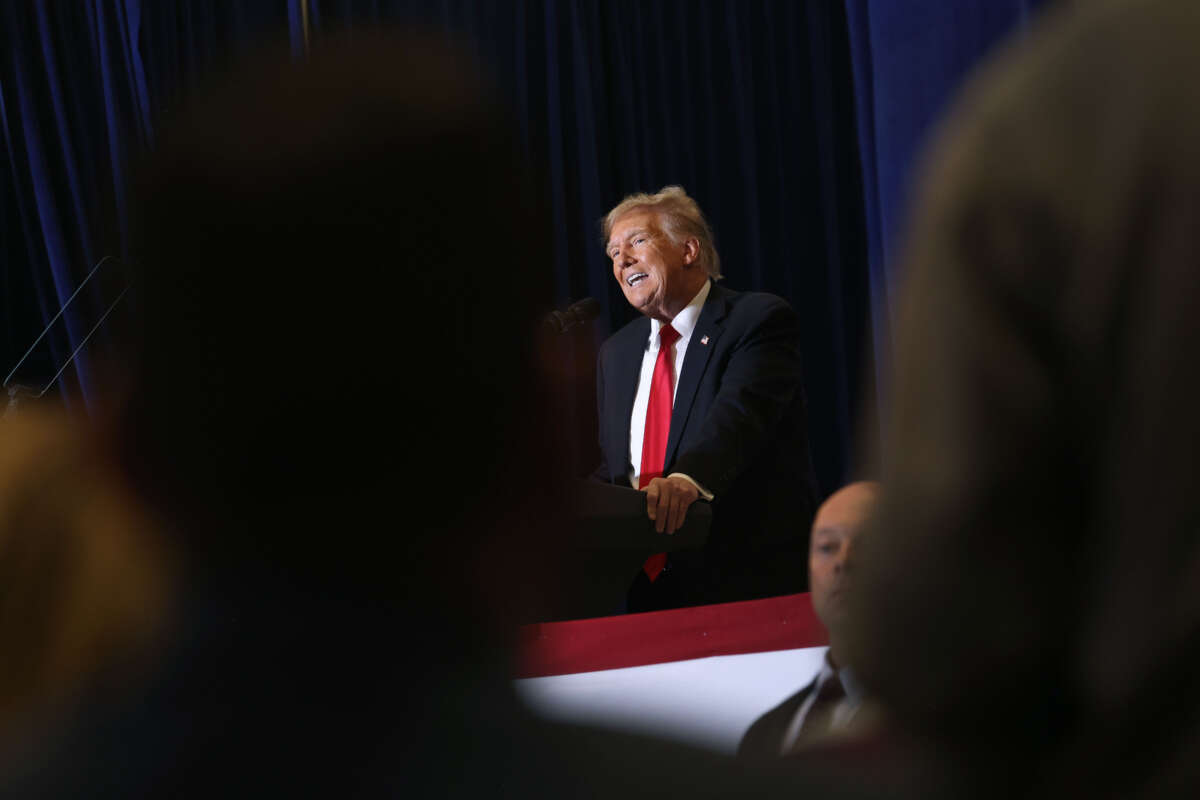 Former President Donald Trump speaks at a campaign event at the Hyatt Hotel on December 13, 2023, in Coralville, Iowa.